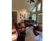 Bright and airy living room with natural light and comfortable leather furniture at 113 Duval Ct, Mooresville, NC 28117