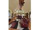 Spacious living room with vaulted ceilings, hardwood floors, and comfortable leather seating at 113 Duval Ct, Mooresville, NC 28117