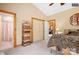 Comfortable main bedroom with carpet, ensuite bathroom and a closet behind double doors at 113 Duval Ct, Mooresville, NC 28117