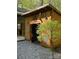 Charming wooden outbuilding featuring rustic decor, an open front, and surrounded by lush greenery at 113 Duval Ct, Mooresville, NC 28117