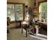 Bright studio space with multiple windows and work tables, great for creating art or hobbies at 113 Duval Ct, Mooresville, NC 28117