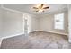 Inviting bedroom with soft carpeting, a ceiling fan, and an open doorway for a spacious feel at 1157 Cedar Grove Ln, Rock Hill, SC 29732