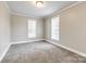 Bedroom features neutral carpet, ceiling fan, and natural light at 1157 Cedar Grove Ln, Rock Hill, SC 29732
