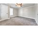 Comfortable bedroom featuring plush carpeting, a ceiling fan, and a window for natural light at 1157 Cedar Grove Ln, Rock Hill, SC 29732