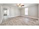 Spacious living room with wood-look flooring, neutral walls, and a ceiling fan, creating a comfortable ambiance at 1157 Cedar Grove Ln, Rock Hill, SC 29732