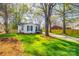 Inviting home with well-maintained lawn, mature trees, and a driveway, offering a serene outdoor setting at 1157 Cedar Grove Ln, Rock Hill, SC 29732