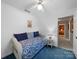 This bedroom offers a cozy daybed and ample natural light at 1206 Heatherloch Dr, Gastonia, NC 28054