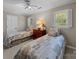 Bedroom with neutral tones, two twin beds, and natural light from two windows at 1206 Heatherloch Dr, Gastonia, NC 28054