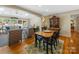 Inviting dining area adjacent to living room offering natural light and pool views at 1206 Heatherloch Dr, Gastonia, NC 28054