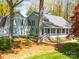Charming home with an attached barn-style garage and a welcoming front porch at 1206 Heatherloch Dr, Gastonia, NC 28054