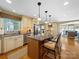 Spacious kitchen with granite countertops, stainless steel appliances, and an island with bar seating at 1206 Heatherloch Dr, Gastonia, NC 28054