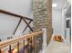 Bright living room features a soaring ceiling, exposed beams, and a stone fireplace at 1206 Heatherloch Dr, Gastonia, NC 28054