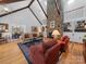 Bright living room featuring a stone fireplace, cathedral ceiling and hardwood floors at 1206 Heatherloch Dr, Gastonia, NC 28054