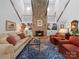 Spacious living room featuring a soaring fireplace and hardwood floors with a luxurious rug at 1206 Heatherloch Dr, Gastonia, NC 28054