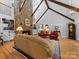 Inviting living room with a soaring stone fireplace, built-in bookshelves, and hardwood floors at 1206 Heatherloch Dr, Gastonia, NC 28054