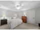 This large main bedroom features a serene atmosphere with neutral walls and coordinated decor at 1206 Heatherloch Dr, Gastonia, NC 28054