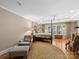 Large main bedroom features hardwood floors, a four-poster bed, and ample natural light at 1206 Heatherloch Dr, Gastonia, NC 28054