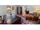 Beautiful office featuring a large desk, leather chair, and a view of the lovely yard at 1206 Heatherloch Dr, Gastonia, NC 28054