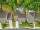 Aerial view of a home with a private backyard, in-ground pool, and mature trees at 1224 Screech Owl Rd, Waxhaw, NC 28173