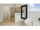 This bathroom showcases a glass-enclosed shower and a corner tub at 1224 Screech Owl Rd, Waxhaw, NC 28173