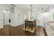 Dining area with hardwood floors, modern lighting and natural light from large windows at 1224 Screech Owl Rd, Waxhaw, NC 28173