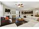 Open concept living room with a fireplace, hardwood floors and seamless access to the kitchen at 1224 Screech Owl Rd, Waxhaw, NC 28173
