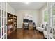 Cozy office with built-in shelves, a desk, and natural light from the window at 1224 Screech Owl Rd, Waxhaw, NC 28173