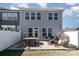 Backyard patio with a dining table, chairs, and a hanging chair, perfect for outdoor entertaining at 1243 Pebble Grove Dr # 442, Clover, SC 29710