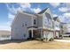 A gray two-story townhome features manicured landscaping and an attached two-car garage at 1243 Pebble Grove Dr # 442, Clover, SC 29710