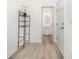 Hallway leading to powder room shows modern, easy-to-clean floors, and a white door at 1243 Pebble Grove Dr # 442, Clover, SC 29710