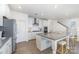 Kitchen featuring white cabinets, stainless steel appliances, and a large island with seating at 1243 Pebble Grove Dr # 442, Clover, SC 29710