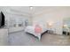 Bright main bedroom with neutral colors, tray ceiling, three windows and soft carpet at 1243 Pebble Grove Dr # 442, Clover, SC 29710