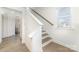 A staircase is shown with white risers and wood treads with a large window at 1243 Pebble Grove Dr # 442, Clover, SC 29710