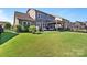 Large backyard with a lush lawn, patio, and plenty of space for outdoor activities at 1255 Fishing Creek Rd, Clover, SC 29710