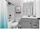 Stylish bathroom features a shower-tub combo, modern fixtures, and neutral grey paint at 1255 Fishing Creek Rd, Clover, SC 29710