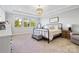 Bright bedroom featuring a large window, chandelier and stylish decor at 1255 Fishing Creek Rd, Clover, SC 29710