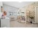 Charming bedroom with playful wallpaper, a fun lofted bed and a bright window at 1255 Fishing Creek Rd, Clover, SC 29710