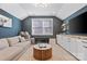 Bonus room with comfortable couch, neutral carpet, media center and decor at 1255 Fishing Creek Rd, Clover, SC 29710