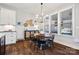 Dining room with a wooden table, black chairs, buffet, and ample natural light at 1255 Fishing Creek Rd, Clover, SC 29710