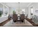Well-lit dining room with a large table, comfortable seating, and elegant decor at 1255 Fishing Creek Rd, Clover, SC 29710