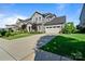 Charming two-story home with a well-manicured lawn, concrete driveway, and an attached two-car garage at 1255 Fishing Creek Rd, Clover, SC 29710