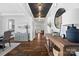 Inviting hallway featuring dark hardwood floors, stylish decor, and a view into other rooms at 1255 Fishing Creek Rd, Clover, SC 29710