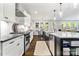 Stylish kitchen with white cabinets, a center island, and a view into the dining area at 1255 Fishing Creek Rd, Clover, SC 29710