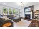 Comfortable living room features a fireplace, large sectional sofa, and lots of natural light at 1255 Fishing Creek Rd, Clover, SC 29710