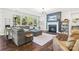 Cozy living room with large sectional sofa, fireplace, and natural light from large windows at 1255 Fishing Creek Rd, Clover, SC 29710