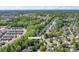 An aerial view showcasing the neighborhood, mature trees, and nearby Uptown Charlotte at 12604 Cardinal Point Rd, Charlotte, NC 28269