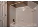 Bright bathroom features a white tiled shower/tub combination at 12604 Cardinal Point Rd, Charlotte, NC 28269