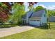 Charming two-story home features a spacious driveway, an attached garage, and beautifully landscaped front yard at 12604 Cardinal Point Rd, Charlotte, NC 28269