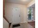 A foyer with decorative tile flooring and a staircase at 12604 Cardinal Point Rd, Charlotte, NC 28269