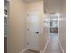 Hallway featuring tile flooring with white trim at 12604 Cardinal Point Rd, Charlotte, NC 28269